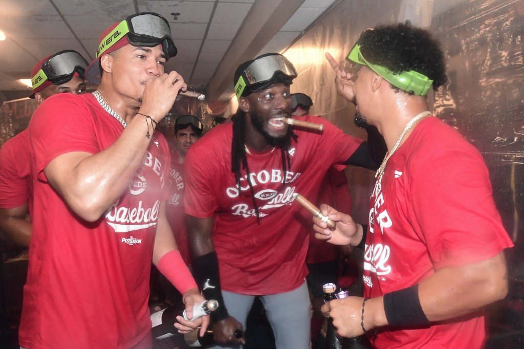 Cincinnati Reds players celebrate clinching a wild card spot.