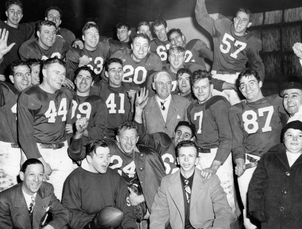 The Cardinals are jubilant after winning the National Football league title in 1947, including Cardinals president Ray Bennigsen, bottom left, and William and Charles Bidwill Jr., sons of the owner, bottom middle. (Chicago Tribune historical photo)