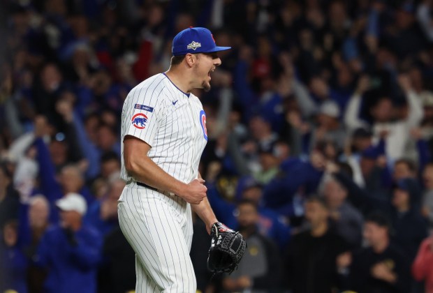 Cubs pitcher Brad Keller yells in celebration of a 4-3 win over the Brewers in Game 3 of the NLDS on Oct. 8, 2025, at Wrigley Field. (John J. Kim/Chicago Tribune)