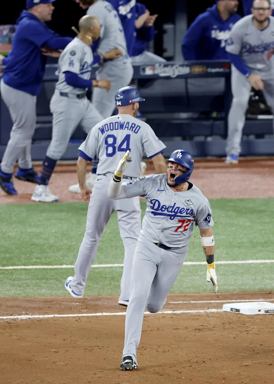 Los Angeles Dodgers Miguel Rojas reacts while rounding the bases.