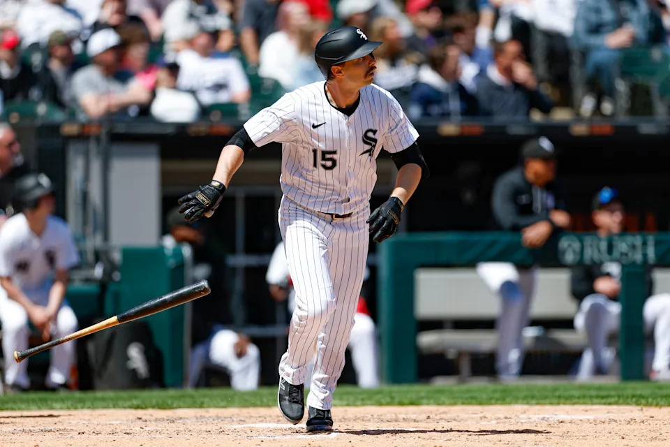 May 25, 2025; Chicago, Illinois, USA; Chicago White Sox left fielder Austin Slater (15) hits a solo home run against the Texas Rangers during the sixth inning at Rate Field. Mandatory Credit: Kamil Krzaczynski-Imagn Images
