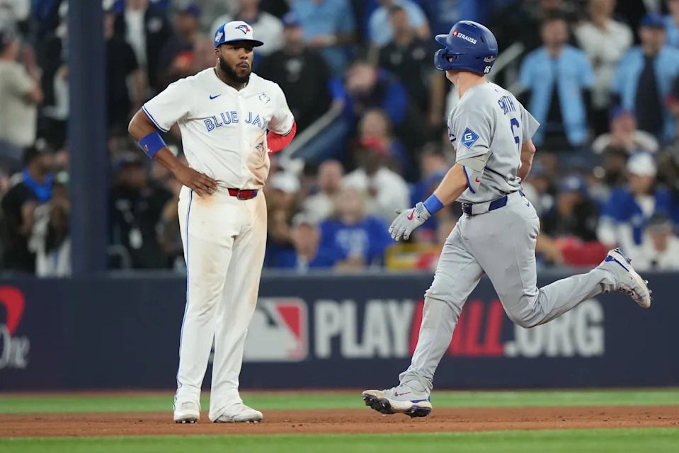 Los Angeles Dodgers' Will Smith (16) celebrates while rounding the bases after hitting a solo home run against the Toronto Blue Jays during 11th inning Game 7 World Series playoff MLB baseball action in Toronto early Sunday, Nov. 2, 2025. THE CANADIAN PRESS/Nathan Denette