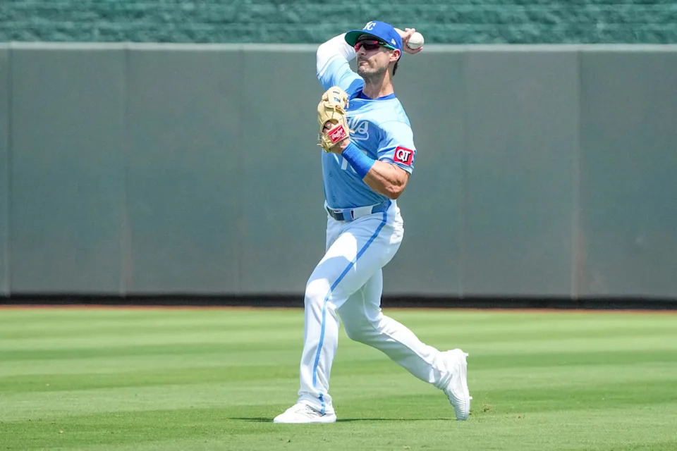 Jul 27, 2025; Kansas City, Missouri, USA; Kansas City Royals right fielder Randal Grichuk (15) fields a fly ball against the Cleveland Guardians during the first inning at Kauffman Stadium. Mandatory Credit: Denny Medley-Imagn Images