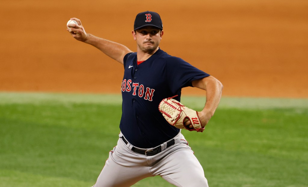 Garrett Whitlock of the Boston Red Sox pitching a baseball.