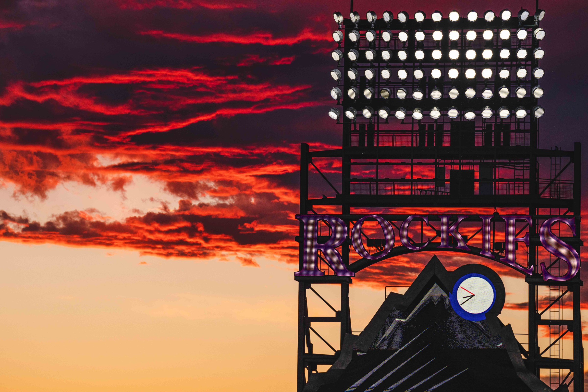DENVER, COLORADO - JUNE 27, 2022: Coors Field at sunset during the game against the Colorado Rockies and Los Angeles Dodgers on June 27, 2022 in Denver, Colorado. (Photo by Harrison Barden/Colorado Rockies/Getty Images)
