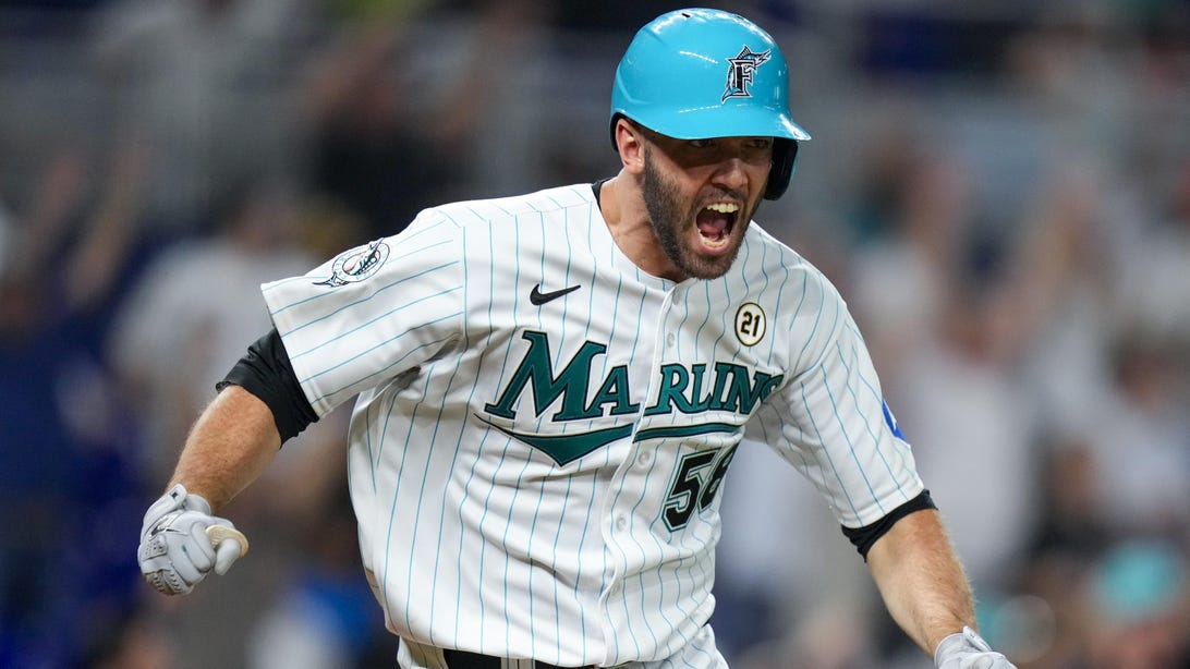 MIAMI, FLORIDA - SEPTEMBER 15: Jacob Stallings #58 of the Miami Marlins reacts after hitting a double to clear the bases against the Atlanta Braves during the eighth inning at loanDepot park on September 15, 2023 in Miami, Florida.