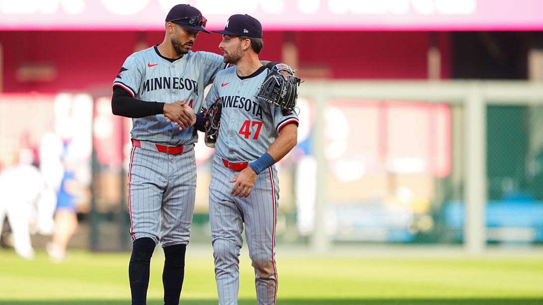 KANSAS CITY, MO - MARCH 28: Carlos Correa #4 and Edouard Julien #47 of the Minnesota Twins celebrate their win after the game between the Minnesota Twins and the Kansas City Royals at Kauffman Stadium on Thursday, March 28, 2024 in Kansas City, Missouri.