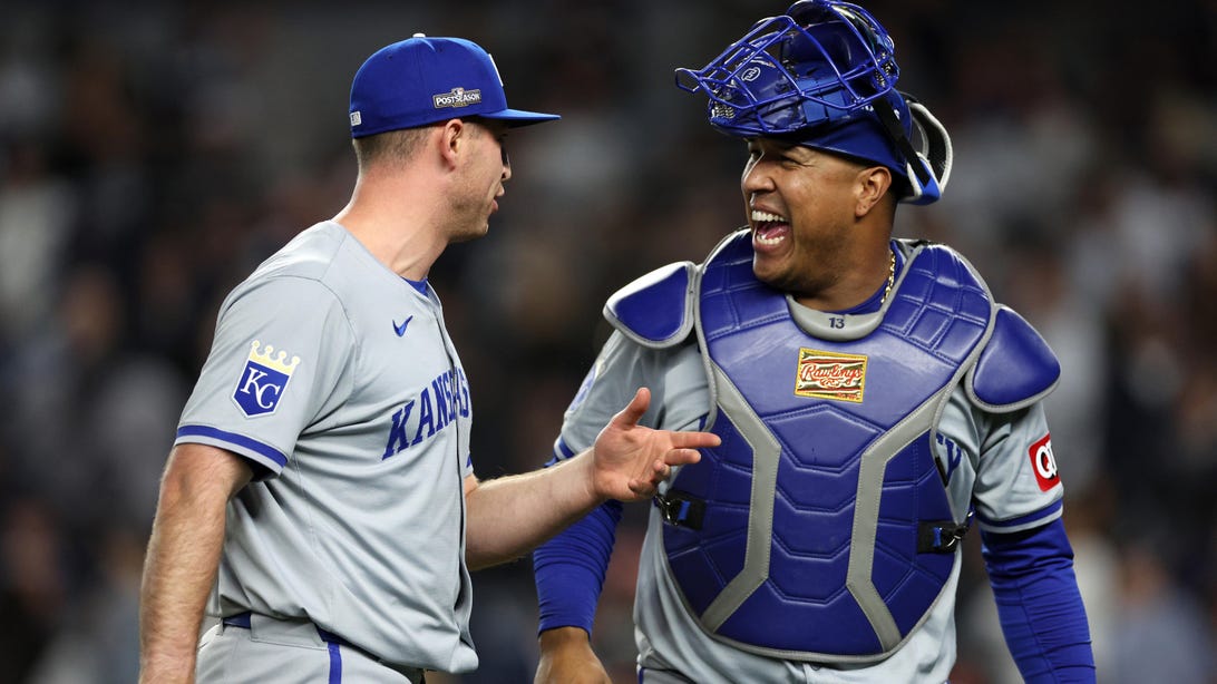 NEW YORK, NEW YORK - OCTOBER 07: Kris Bubic #50 and Salvador Perez #13 of the Kansas City Royals react after the end of the eighth inning against the New York Yankees during Game Two of the Division Series at Yankee Stadium on October 07, 2024 in New York City.