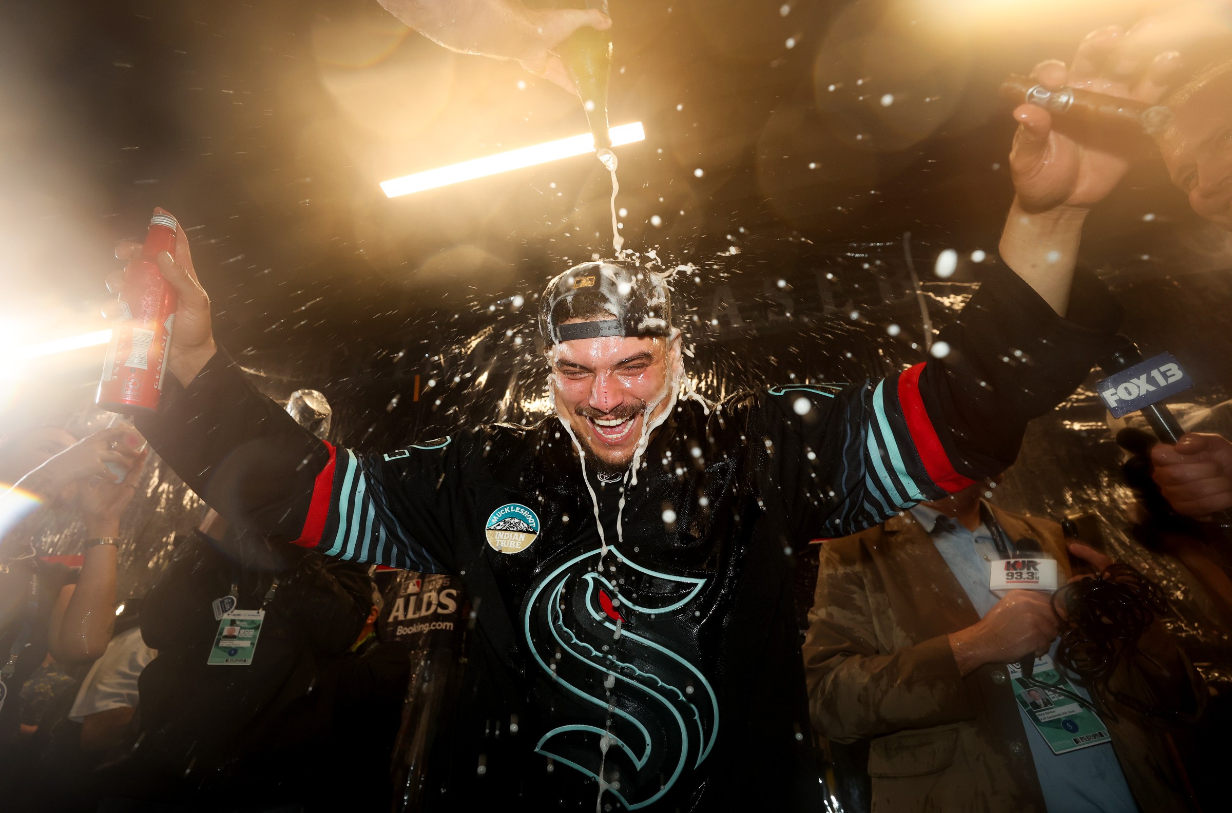 SEATTLE, WASHINGTON - OCTOBER 10: Josh Naylor #12 of the Seattle Mariners celebrates in the locker room after the team’s 3-2 win against the Detroit Tigers in game five of the American League Division Series at T-Mobile Park on October 10, 2025 in Seattle, Washington. (Photo by Steph Chambers/Getty Images)