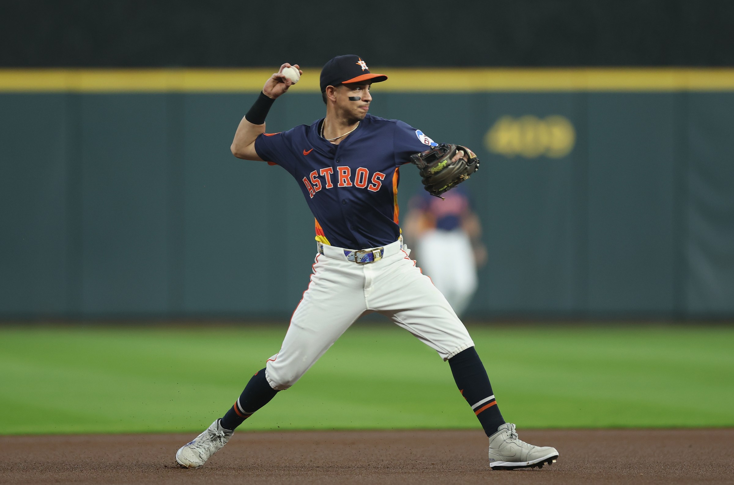 HOUSTON, TEXAS - SEPTEMBER 21: Mauricio Dubon #14 of the Houston Astros throws to first for an out in the first inning against the Seattle Mariners at Daikin Park on September 21, 2025 in Houston, Texas. (Photo by Tim Warner/Getty Images)