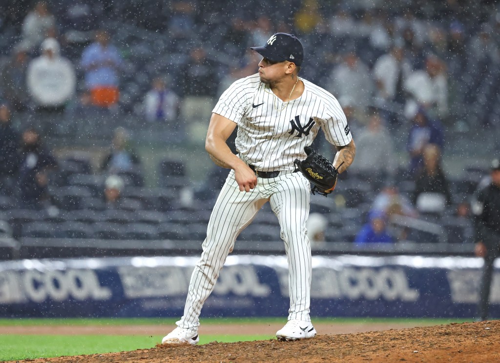 New York Yankees pitcher Jonathan Loáisiga #43 throws a pitch during the 11th inning.