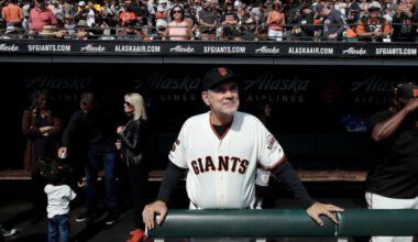 FILE - San Francisco Giants manager Bruce Bochy stands in the dugout before a baseball game between the Giants and the Los Angeles Dodgers in San Francisco, Sept. 29, 2019. (AP Photo/Jeff Chiu, File)