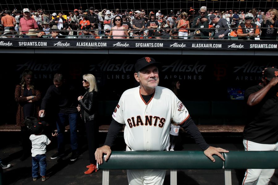 FILE - San Francisco Giants manager Bruce Bochy stands in the dugout before a baseball game between the Giants and the Los Angeles Dodgers in San Francisco, Sept. 29, 2019. (AP Photo/Jeff Chiu, File)