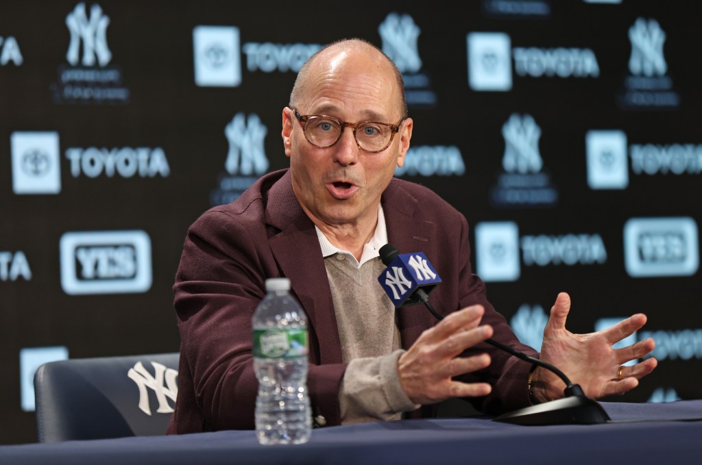 New York Yankees GM Brian Cashman speaking at a press conference at Yankee Stadium.