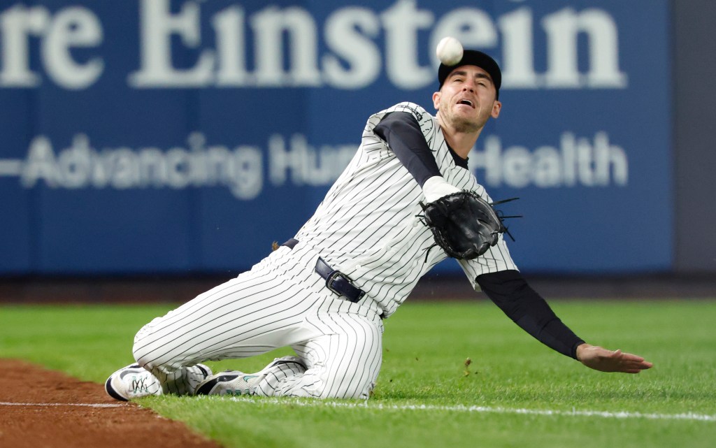 Yankees left fielder Cody Bellinger makes a sliding catch against the Blue Jays during Game 4 of the ALDS on Oct. 8, 2025.