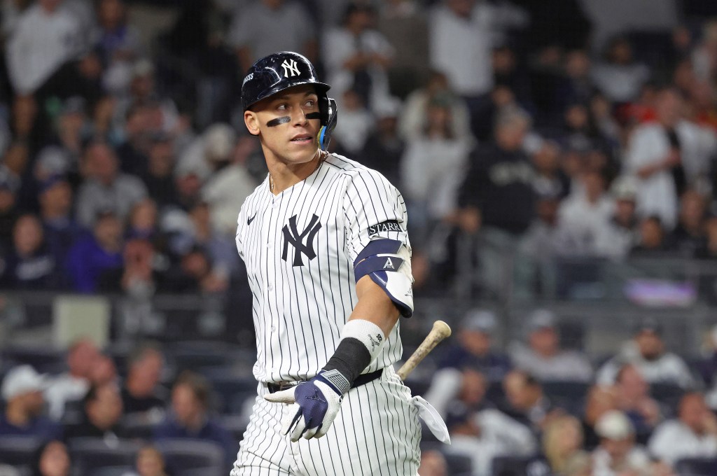 New York Yankees right fielder Aaron Judge in a pinstriped uniform reacts after striking out.
