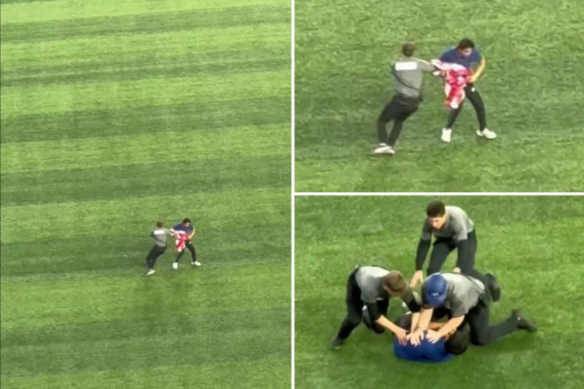 Fan runs onto field with American flag to delay World Series Game 6
