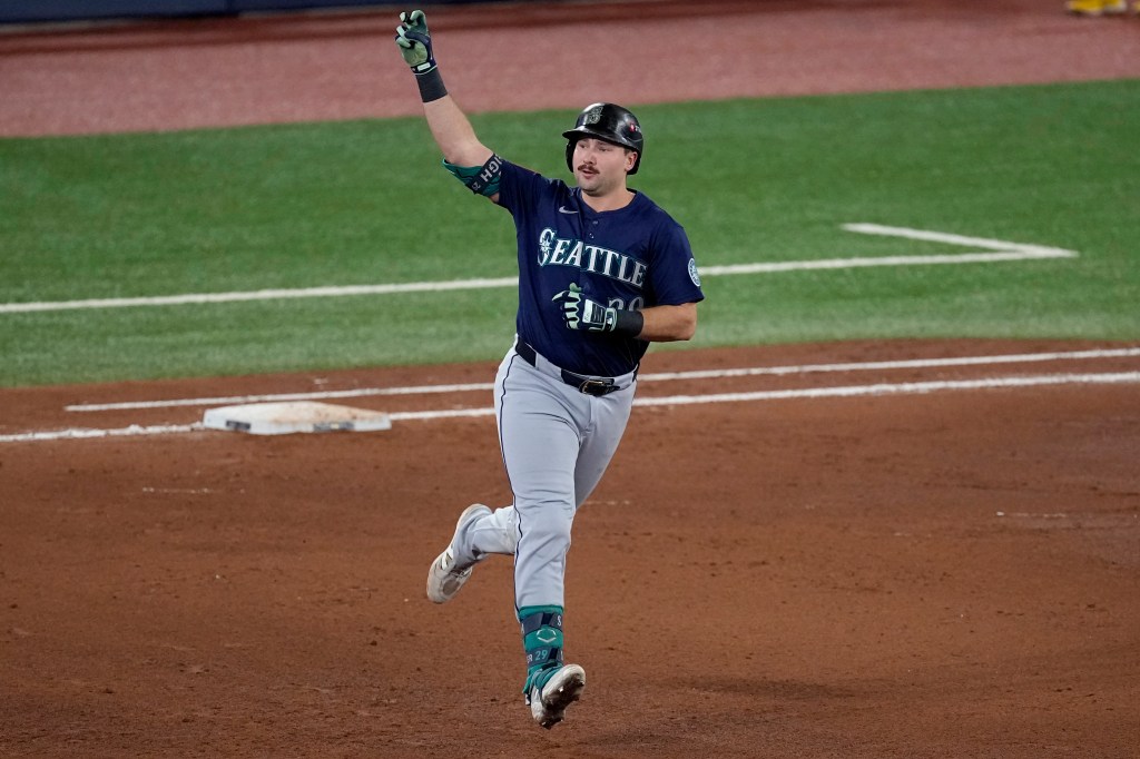 Seattle Mariners' Cal Raleigh celebrates his solo home run.