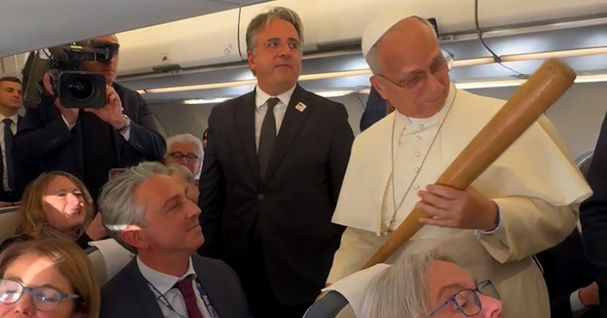 "How did you get this through security?" Pope Leo asks CBS News' Chris Livesay of White Sox baseball bat gift
