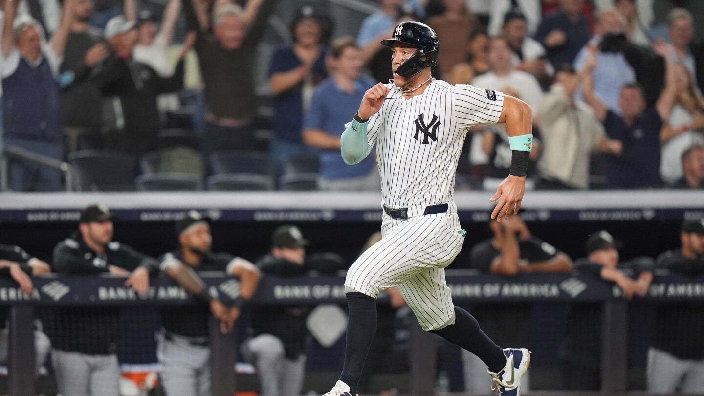 Judge reaches 50 homers for 4th time, hits pair as Yanks tie for AL East lead by beating White Sox