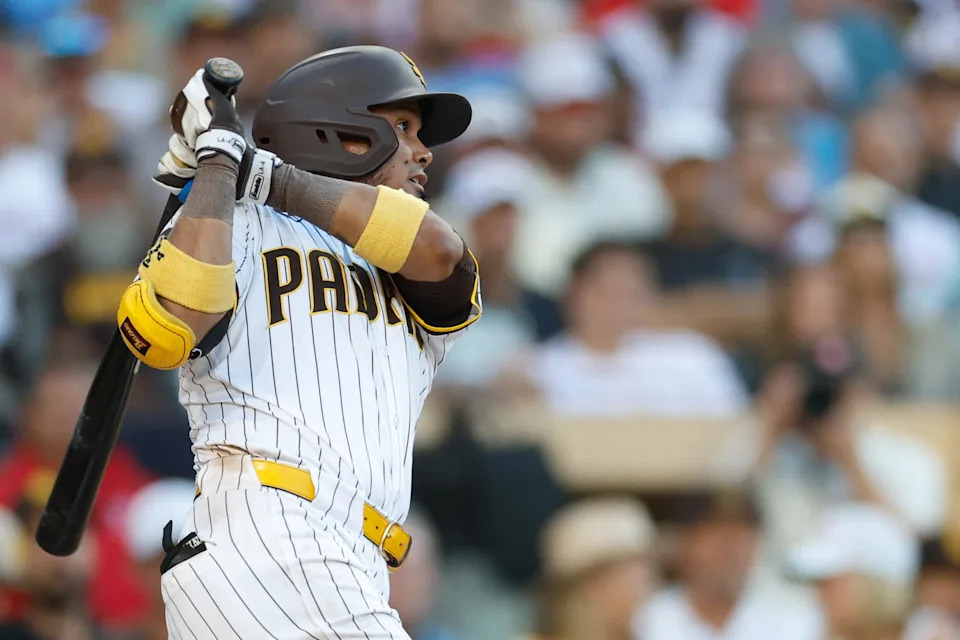 Jul 12, 2025; San Diego, California, USA; San Diego Padres first baseman Luis Arraez (4) hits a single during the seventh inning against the Philadelphia Phillies at Petco Park. Mandatory Credit: David Frerker-Imagn Images