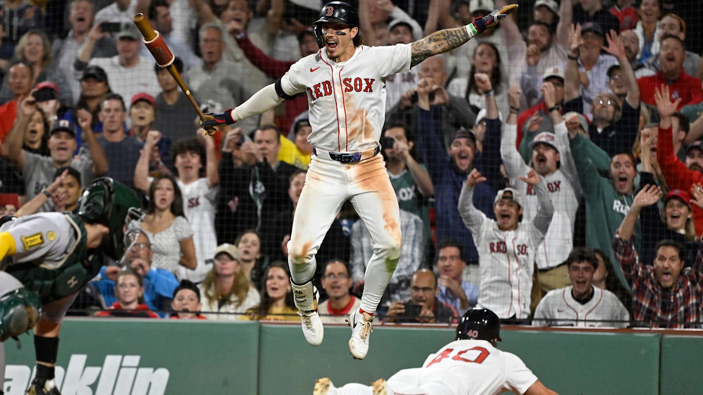 Sep 17, 2025; Boston, Massachusetts, USA; Boston Red Sox left fielder Jarren Duran (16) reacts as third baseman Nate Eaton (40) slides home to score the winning run against Athletics catcher Shea Langeliers (23) during the tenth inning at Fenway Park. Mandatory Credit: Eric Canha-Imagn Images