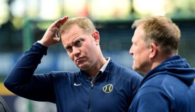 Oct 2, 2024; Milwaukee, Wisconsin, USA; Milwaukee Brewers general manager Matt Arnold talks to manager Matt Arnold before game two of the Wildcard round for the 2024 MLB Playoffs against the New York Mets at American Family Field. Mandatory Credit: Benny Sieu-Imagn Images