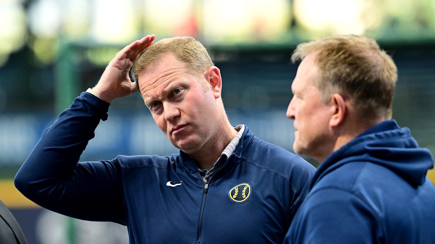 Oct 2, 2024; Milwaukee, Wisconsin, USA; Milwaukee Brewers general manager Matt Arnold talks to manager Matt Arnold before game two of the Wildcard round for the 2024 MLB Playoffs against the New York Mets at American Family Field. Mandatory Credit: Benny Sieu-Imagn Images