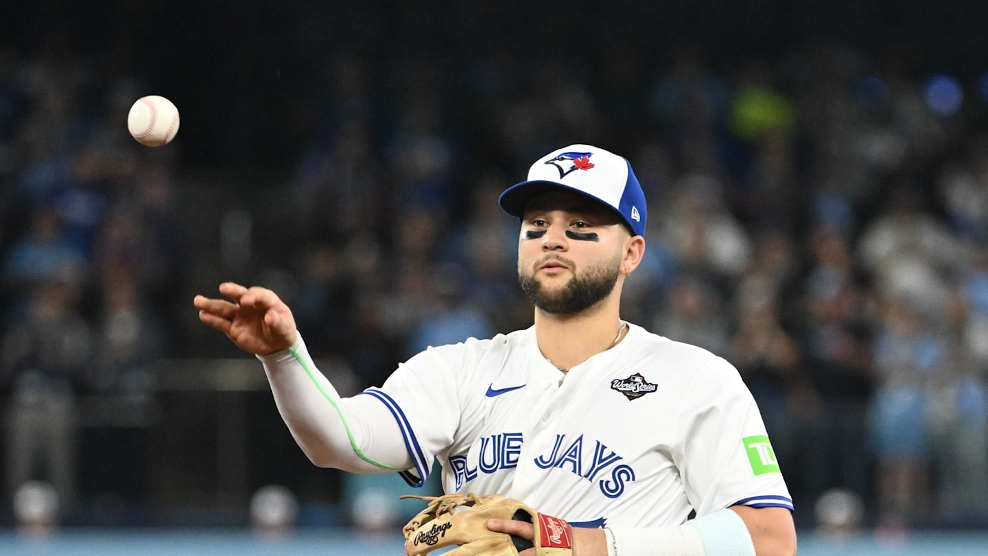 Oct 24, 2025; Toronto, Ontario, CAN; Toronto Blue Jays second baseman Bo Bichette (11) makes a play to get out Los Angeles Dodgers first baseman Freddie Freeman (not pictured) in the first inning during game one of the 2025 MLB World Series at Rogers Centre. Mandatory Credit: Dan Hamilton-Imagn Images