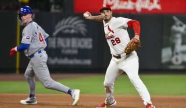 Jun 24, 2025; St. Louis, Missouri, USA;  St. Louis Cardinals third baseman Nolan Arenado (28) barehands a ground ball and throws out Chicago Cubs shortstop Dansby Swanson (not pictured) during the ninth inning at Busch Stadium. Mandatory Credit: Jeff Curry-Imagn Images