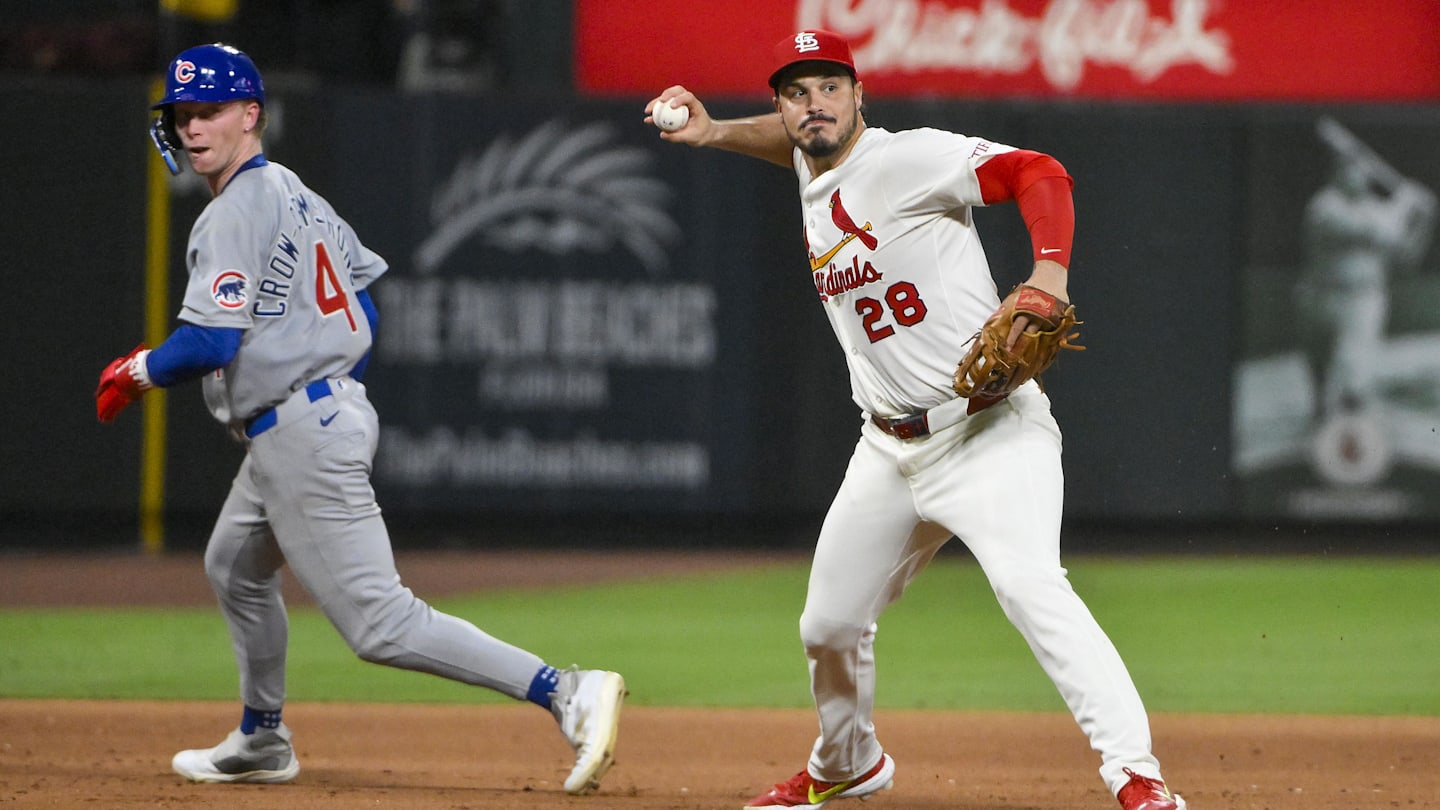 Jun 24, 2025; St. Louis, Missouri, USA;  St. Louis Cardinals third baseman Nolan Arenado (28) barehands a ground ball and throws out Chicago Cubs shortstop Dansby Swanson (not pictured) during the ninth inning at Busch Stadium. Mandatory Credit: Jeff Curry-Imagn Images