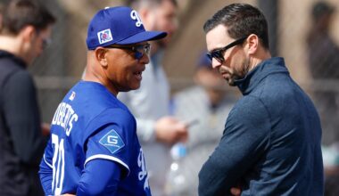 Los Angeles Dodgers manager Dave Roberts and general manager Brandon Gomes.