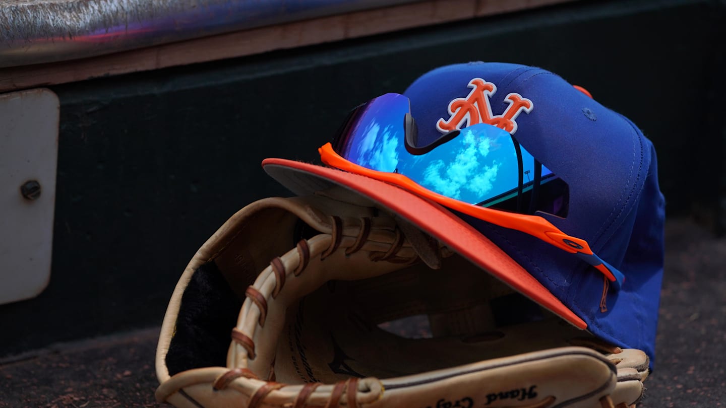 Mar 24, 2018; Jupiter, FL, USA; A New York Mets hat with sunglasses sits on a glove in the dugout during a spring training game between the St. Louis Cardinals and the New York Mets at Roger Dean Stadium. Mandatory Credit: Jasen Vinlove-Imagn Images