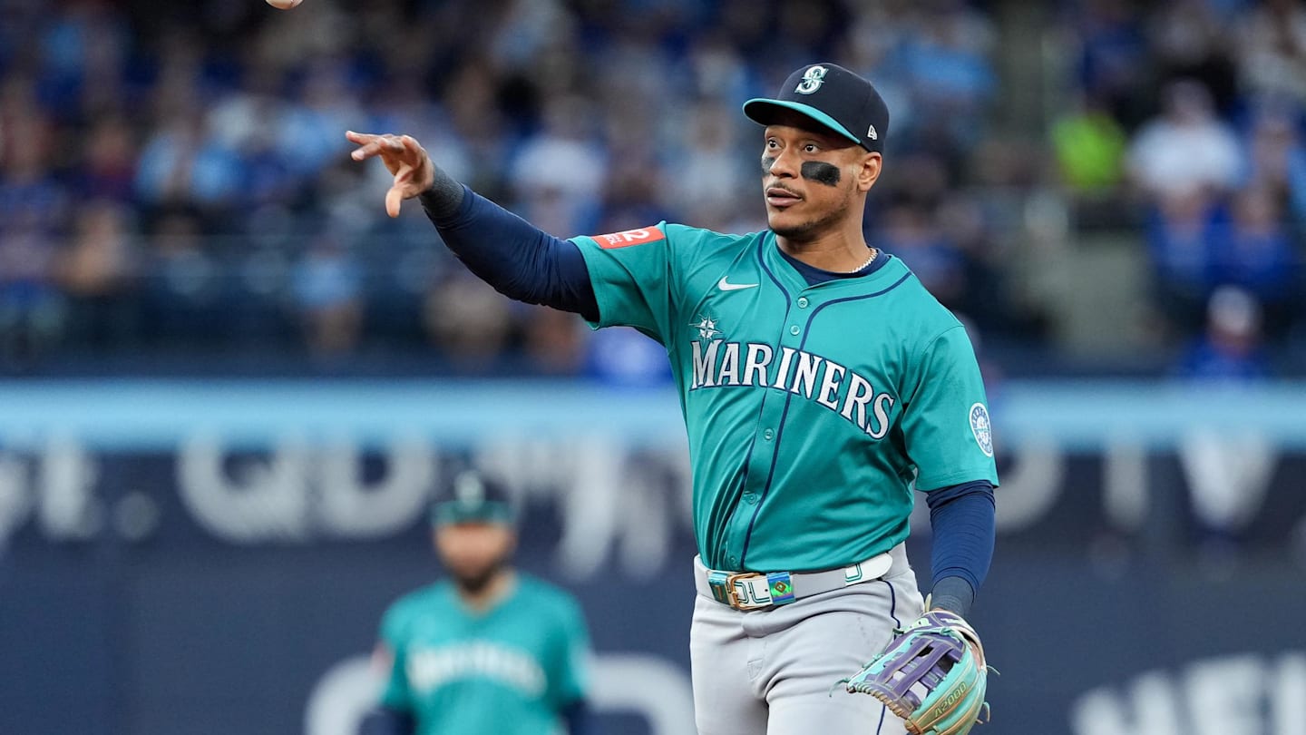 Oct 13, 2025; Toronto, Ontario, CAN; Seattle Mariners infielder Jorge Polanco (7) throws to first base for the first out in the third inning against the Toronto Blue Jays during game two of the ALCS round for the 2025 MLB playoffs at Rogers Centre. Mandatory Credit: Nick Turchiaro-Imagn Images