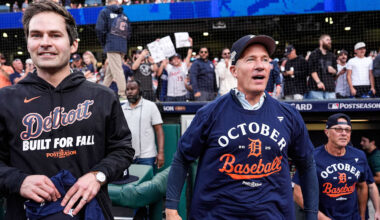 Detroit Tigers president of baseball operations Scott Harris, left, and owner Christopher Ilitch celebrate the 6-3 win over the Cleveland Guardians in Game 3 of the AL wild-card series at Progressive Field in Cleveland on Thursday, Oct. 2, 2025.