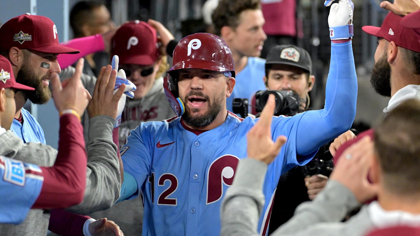 Oct 8, 2025; Los Angeles, California, USA; Philadelphia Phillies designated hitter Kyle Schwarber (12) congratulated in the dugout after hitting a solo home run in the fourth inning against the Los Angeles Dodgers of game three of the NLDS during the 2025 MLB playoffs at Dodger Stadium.