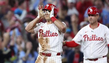 Oct 4, 2025; Philadelphia, Pennsylvania, USA; Philadelphia Phillies catcher J.T. Realmuto (10) reacts after hitting a two RBI triple against the Los Angeles Dodgers in the second inning during game one of the NLDS round for the 2025 MLB playoffs at Citizens Bank Park.