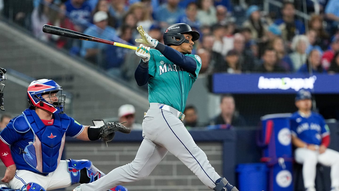 Oct 13, 2025; Toronto, Ontario, CAN; Seattle Mariners infielder Jorge Polanco (7) hits a three run home run in the fifth inning against the Toronto Blue Jays during game two of the ALCS round for the 2025 MLB playoffs at Rogers Centre. Mandatory Credit: Nick Turchiaro-Imagn Images