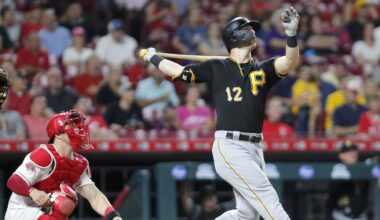Jul 30, 2019; Cincinnati, OH, USA; Pittsburgh Pirates left fielder Corey Dickerson (12) follows through on a swing for a solo home run against the Cincinnati Reds during the seventh inning at Great American Ball Park. Mandatory Credit: David Kohl-Imagn Images