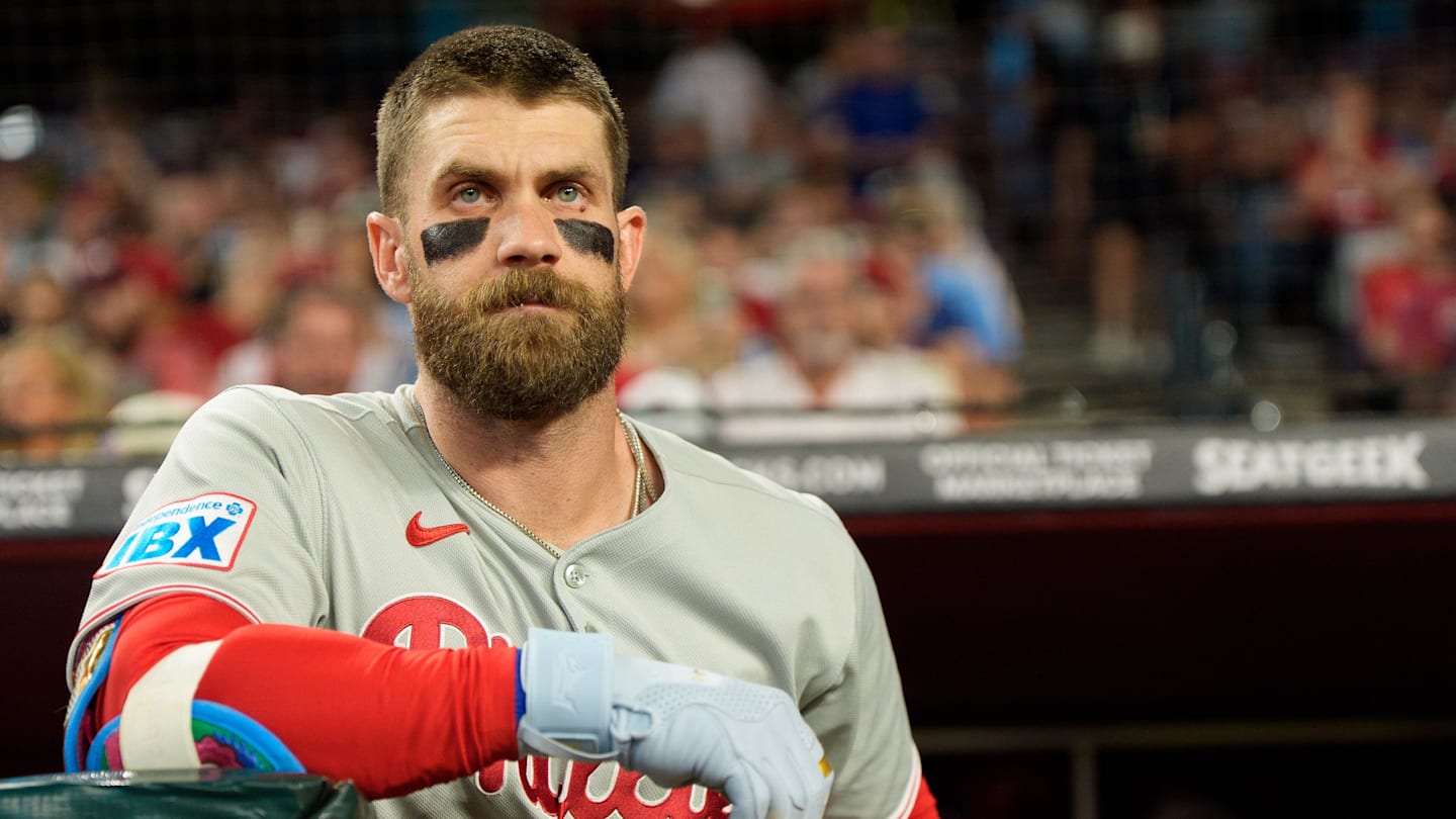 Sep 19, 2025; Phoenix, Arizona, USA;  Philadelphia Phillies infielder Bryce Harper (3) watches on from the dugout before his first at bat of the game against the Arizona Diamondbacks at Chase Field.