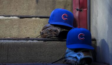 Sep 20, 2025; Cincinnati, Ohio, USA; Chicago player hats are seen on the dugout steps during the game between the Chicago Cubs and the Cincinnati Reds at Great American Ball Park. Mandatory Credit: Aaron Doster-Imagn Images