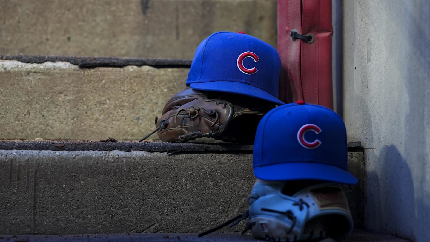 Sep 20, 2025; Cincinnati, Ohio, USA; Chicago player hats are seen on the dugout steps during the game between the Chicago Cubs and the Cincinnati Reds at Great American Ball Park. Mandatory Credit: Aaron Doster-Imagn Images