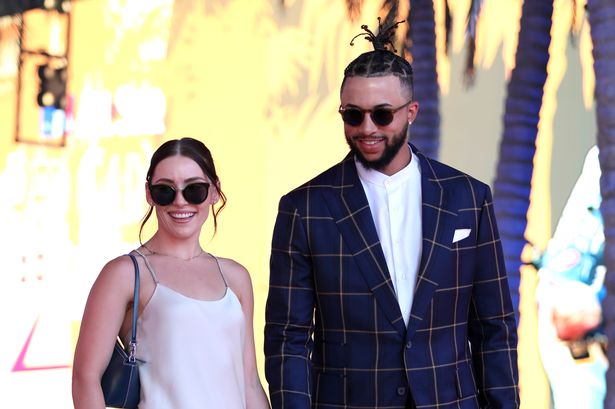 Devin Williams and Maggie Badock wall the red carpet at the All Star Game