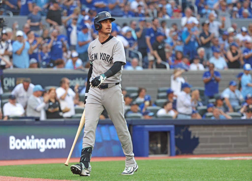 Cody Bellinger #35 of the New York Yankees reacts after he strikes out swinging during the fourth inning against the Blue Jays. 