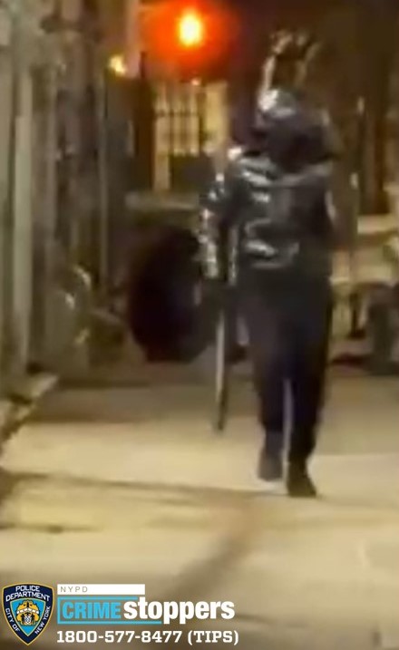 The man struck the victim in the face with a black baseball bat.