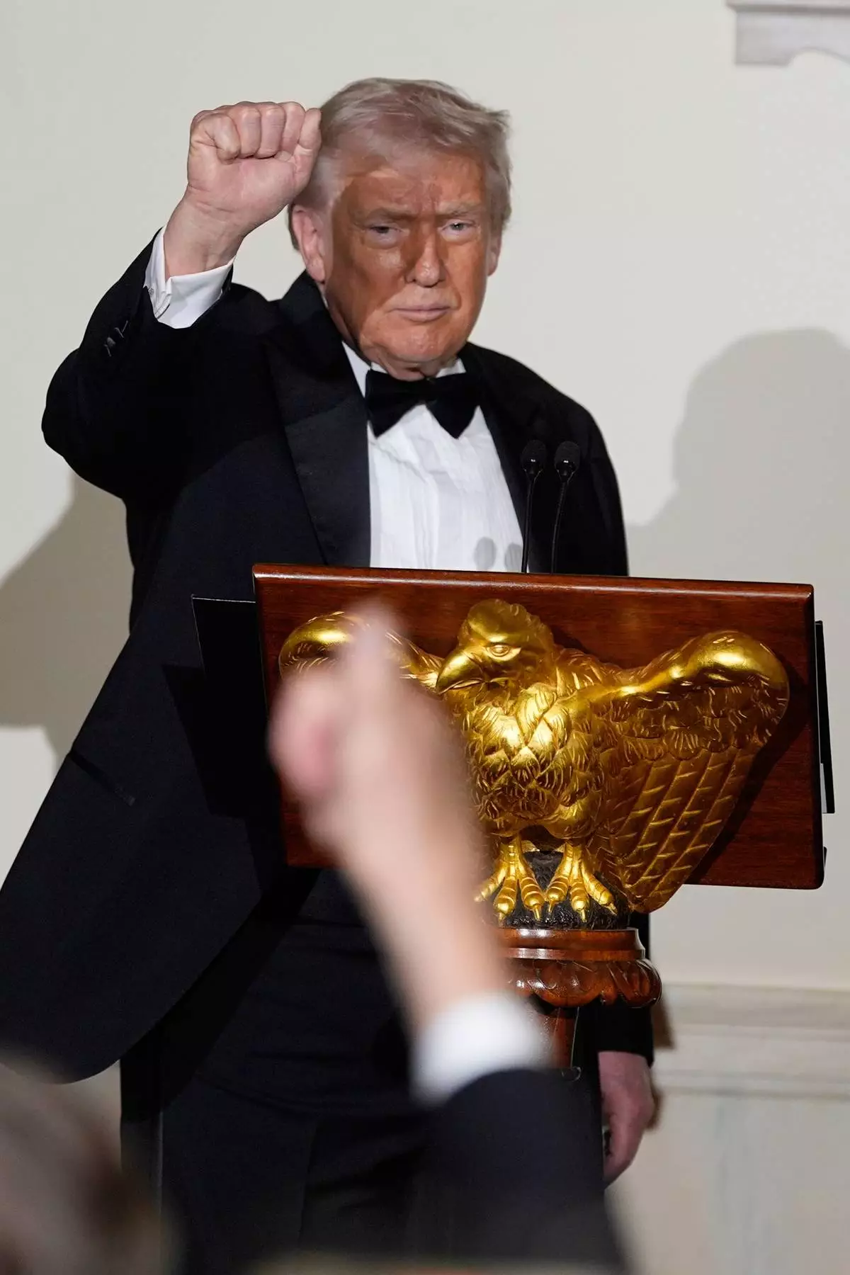 President Donald Trump reacts to guests in the Grand Foyer of the White House during the Congressional Ball, Thursday, Dec. 11, 2025, in Washington. (AP Photo/Alex Brandon)