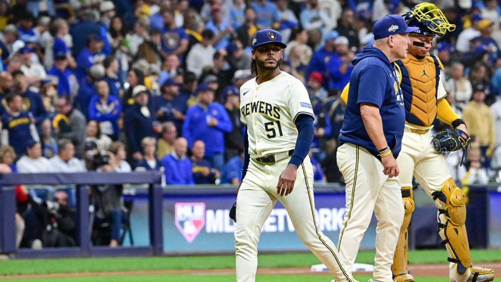 Milwaukee Brewers pitcher Freddy Peralta (51) leaves the mound as he is relieved by manager Pat Murphy (49) in the sixth inning during game two of the NLCS round against the Los Angeles Dodgers for the 2025 MLB playoffs at American Family Field.