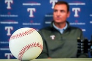 A baseball rests on a table as Texas Rangers president of baseball operations Chris Young...
