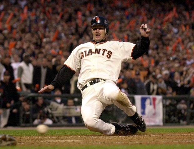 KRT SPORTS STORY SLUGGED: SERIES KRT PHOTO BY KARL MONDON/CONTRA COSTA TIMES (October 24) SAN FRANCISCO, CA -- The Giants' Jeff Kent slides safely into home in the second inning of game 5 of the 2002 World Series on Thursday, October 24, 2002 at Pac Bell Park in San Francisco, California. (CC) NC KD BL 2002 (Horiz) (mvw). [Baseball, Pro, World Series]. ORG XMIT: KRT