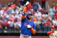 New York Mets' Brandon Nimmo celebrates after hitting an RBI double in the first inning...